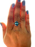 Oval Cut Vivid Blue Hidden Halo Engagement Ring