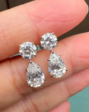 Pear And Round Diamond Drop Earrings..