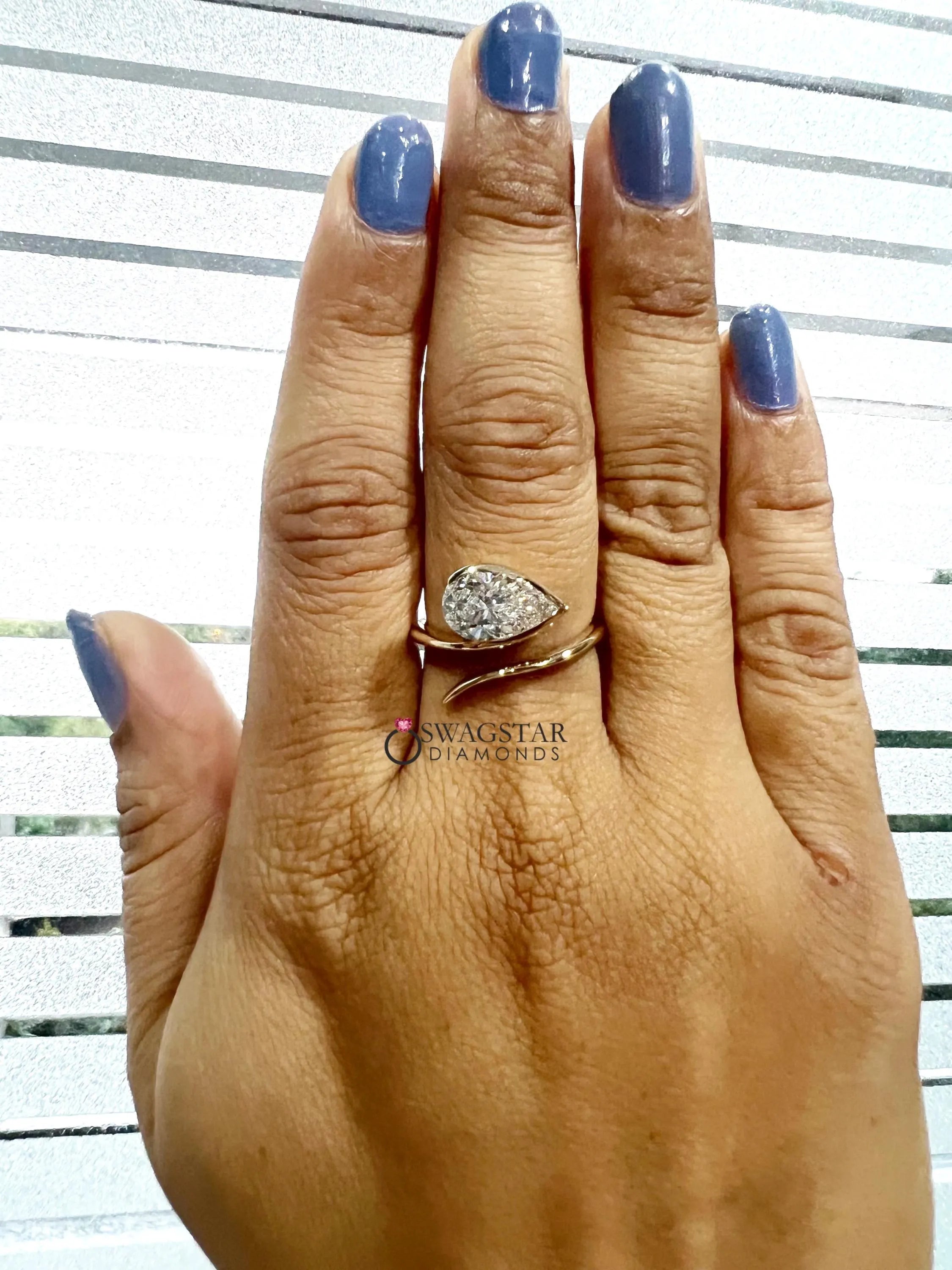 Pear Cut Half Bezel Set Solitaire Ring.